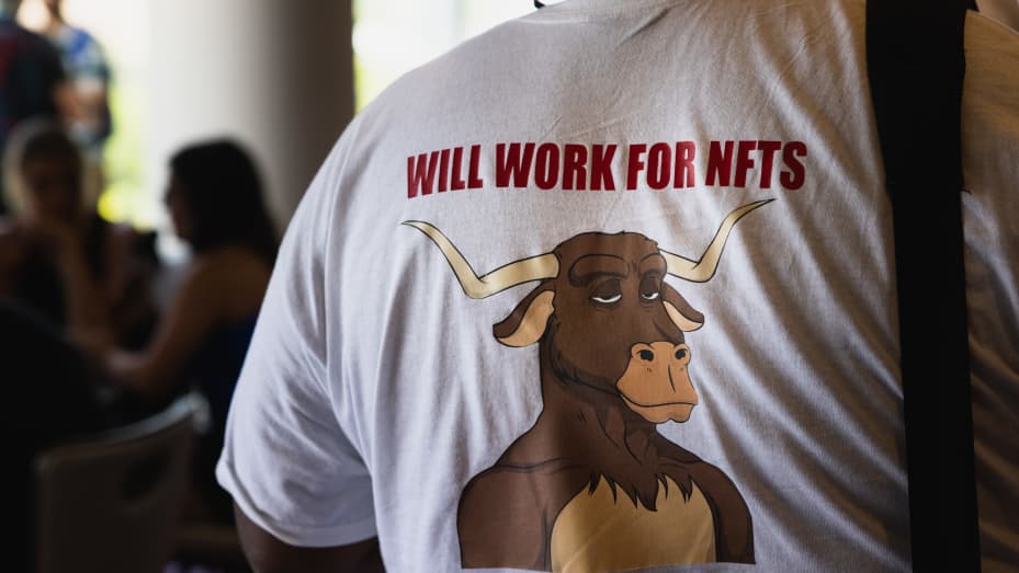 An attendee wears a "Will Work for NFTs" shirt during the CoinDesk 2022 Consensus Festival in Austin, Texas, US, on Thursday, June 9, 2022. The festival showcases all sides of the blockchain, crypto, NFT, and Web 3 ecosystems, and their wide-reaching effect on commerce, culture, and communities.