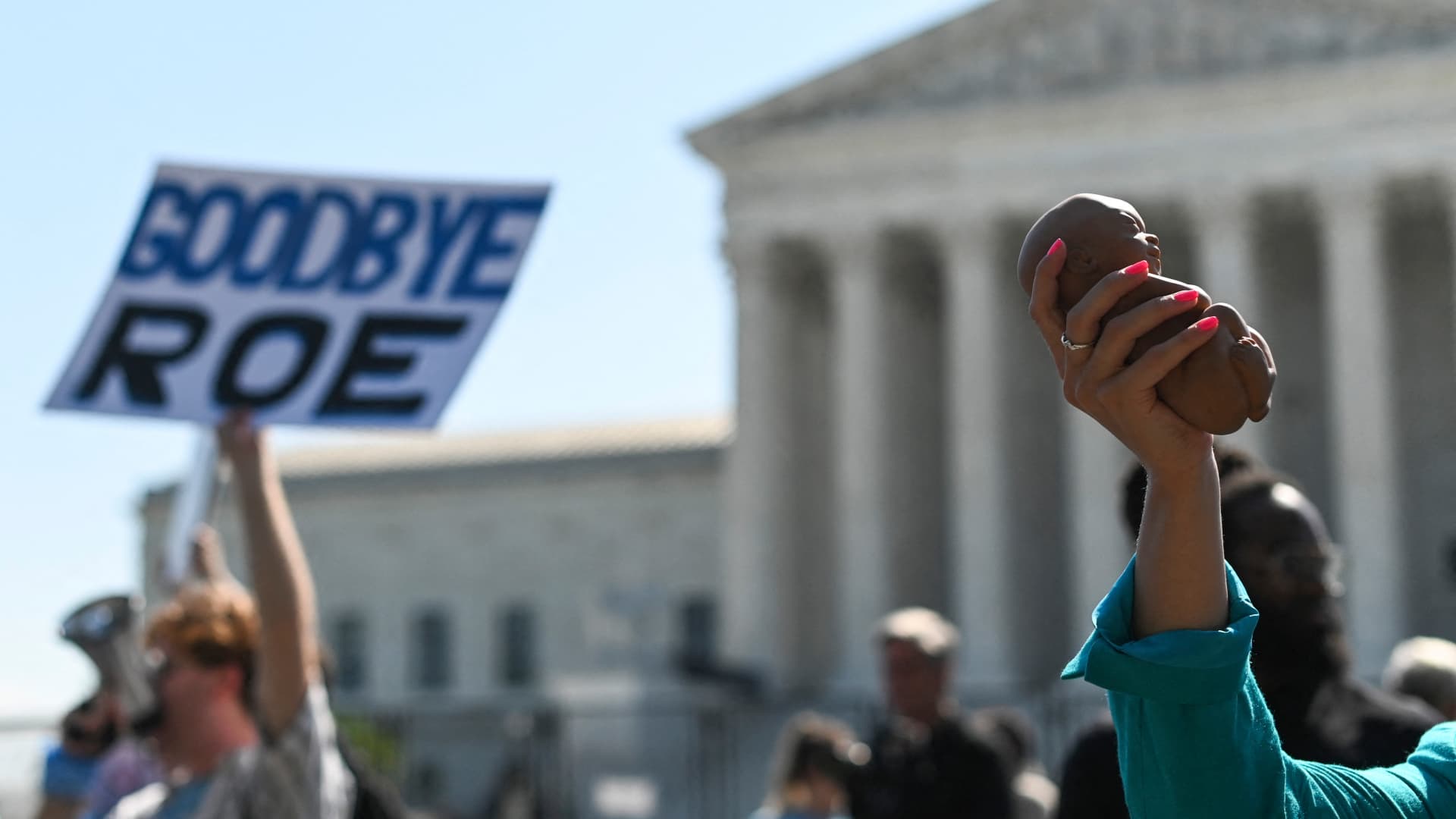 Anti-abortion protestors march in front of the U.S. Supreme Court building as the court considers overturning Roe v. Wade on June 13, 2022, in Washington, DC.