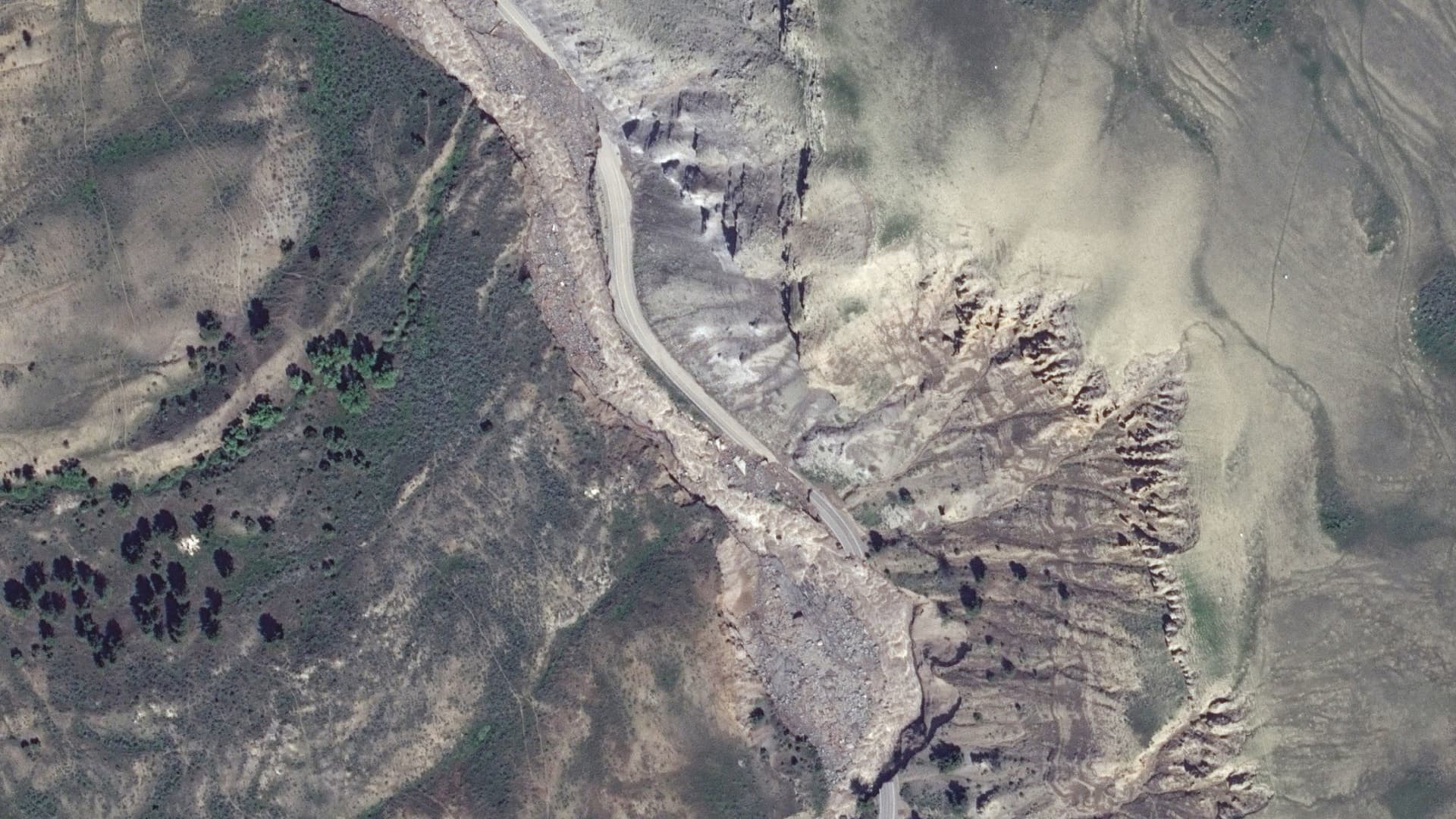 A satellite image shows an overview of road washouts south of Yellowstone National Park north entrance, Montana, U.S. June 15, 2022.