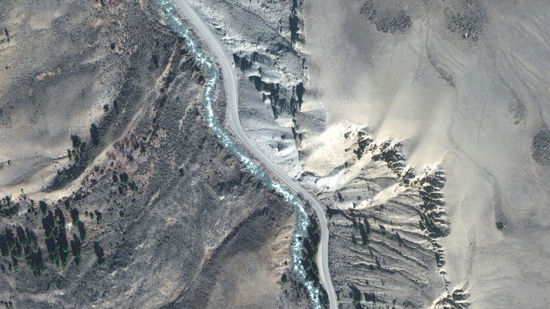 A satellite image shows an overview of a road before flooding South of Yellowstone National Park north entrance, Montana, U.S. March 30, 2022. 