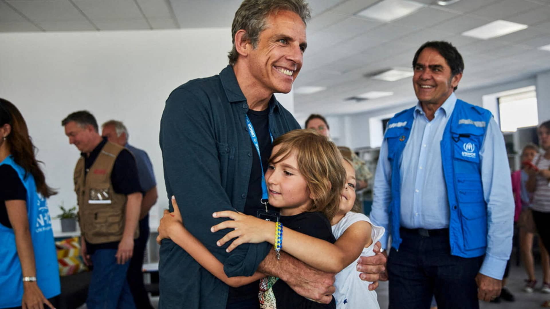 Goodwill Ambassador actor Ben Stiller embraces children at a UNHCR Protection Hub providing psycho-social support, SGBV prevention and response and child protection and legal aid services in Medyka, Poland June 18, 2022. 