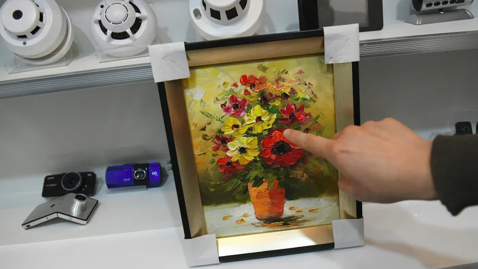 This picture taken on March 22, 2019 shows a painting installed with a hidden camera on display at a spy camera shop in the port city of Incheon. - Spycam business is facing an increasingly negative public sentiment after a series of hidden camera scandals hit the ultra-wired South Korea, where many women fear daily of being secretly filmed by so-called "molka", or spycam videos, in schools and toilets, among other places. (Photo by JUNG Yeon-Je / AFP)        (Photo credit should read JUNG YEON-JE/AFP via G