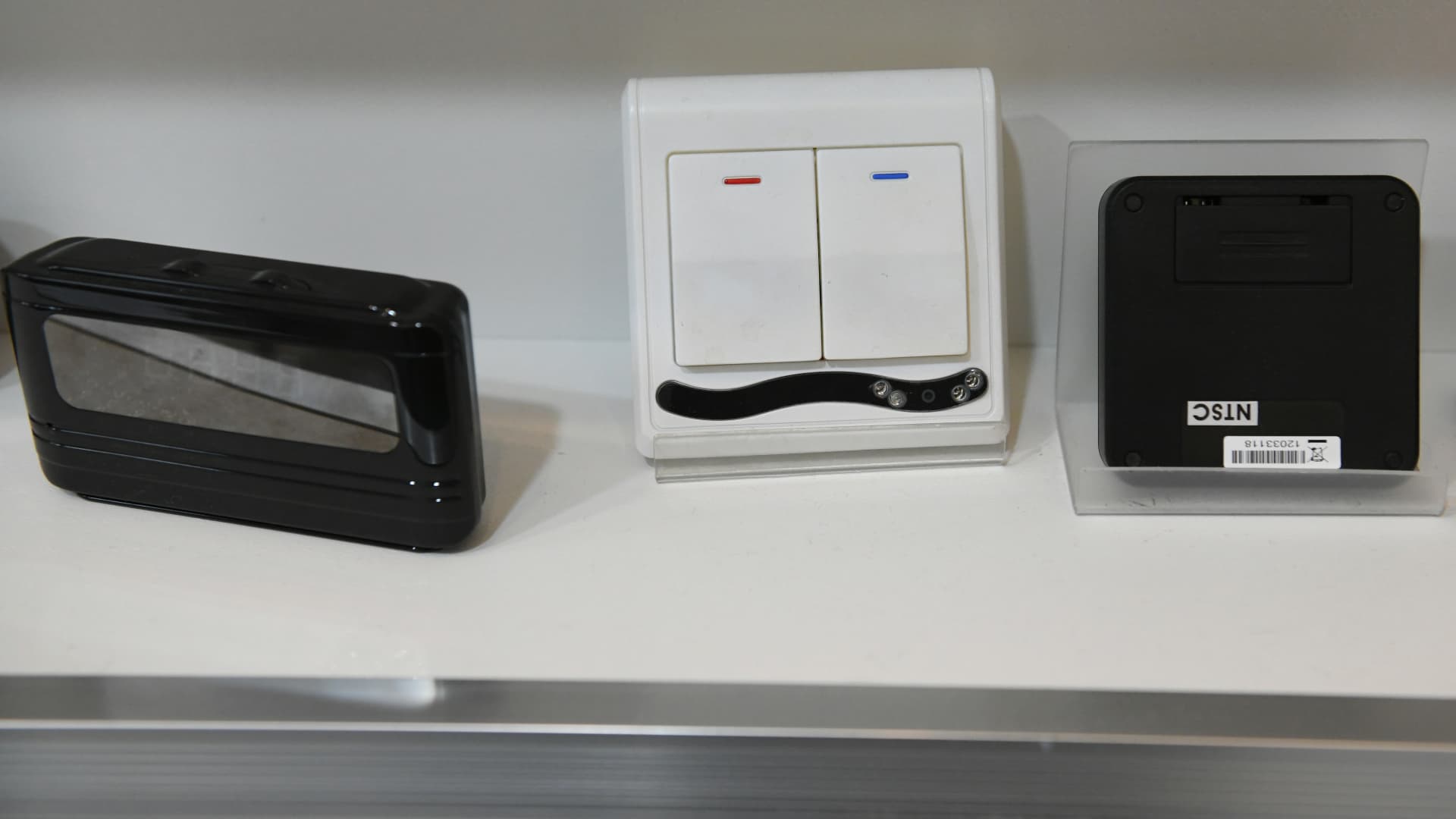 A light switch with a hidden camera (middle) on display at a spy camera shop in South Korea on March 22, 2019.