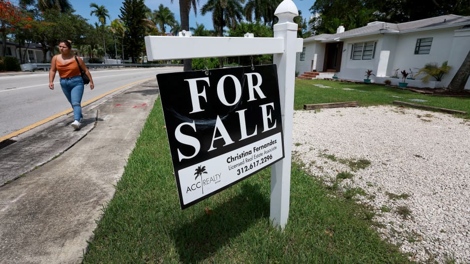 A 'for sale' sign hangs in front of a home on June 21, 2022 in Miami, Florida. According to the National Association of Realtors, sales of existing homes dropped 3.4% to a seasonally adjusted annualized rate of 5.41 million units. Sales were 8.6% lower than in May 2021. As existing-home sales declined, the median price of a house sold in May was $407,600, an increase of 14.8% from May 2021.