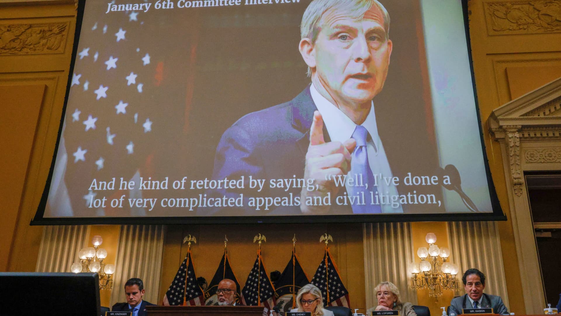 A video former Acting Deputy Attorney General Richard Donoghue speaking is shown on a screen during the fifth public hearing of the U.S. House Select Committee to Investigate the January 6 Attack on the United States Capitol, on Capitol Hill in Washington, U.S., June 23, 2022. 