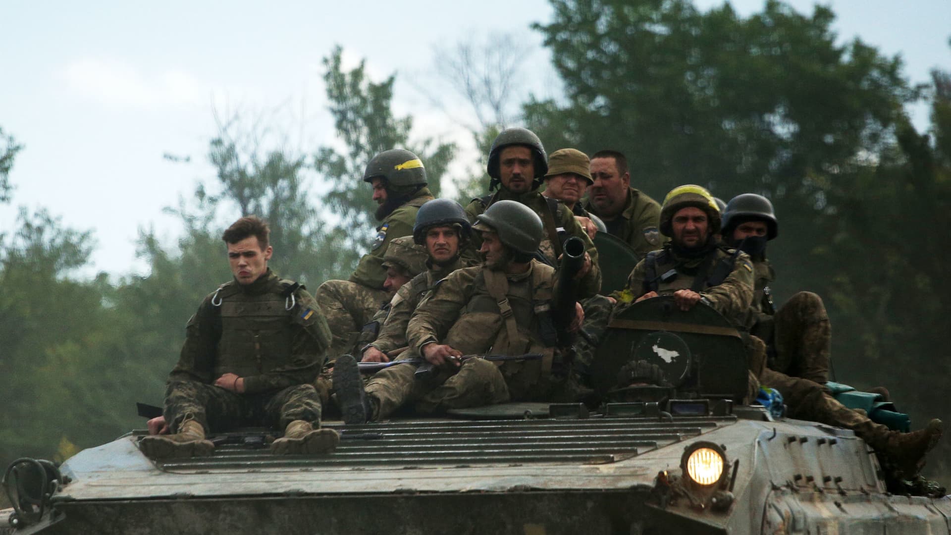 Ukrainian soldiers ride on an armored personnel carrier in the Luhansk region on June 23, 2022. Luhansk is currently the site of the fiercest fighting between Russia and Ukraine.