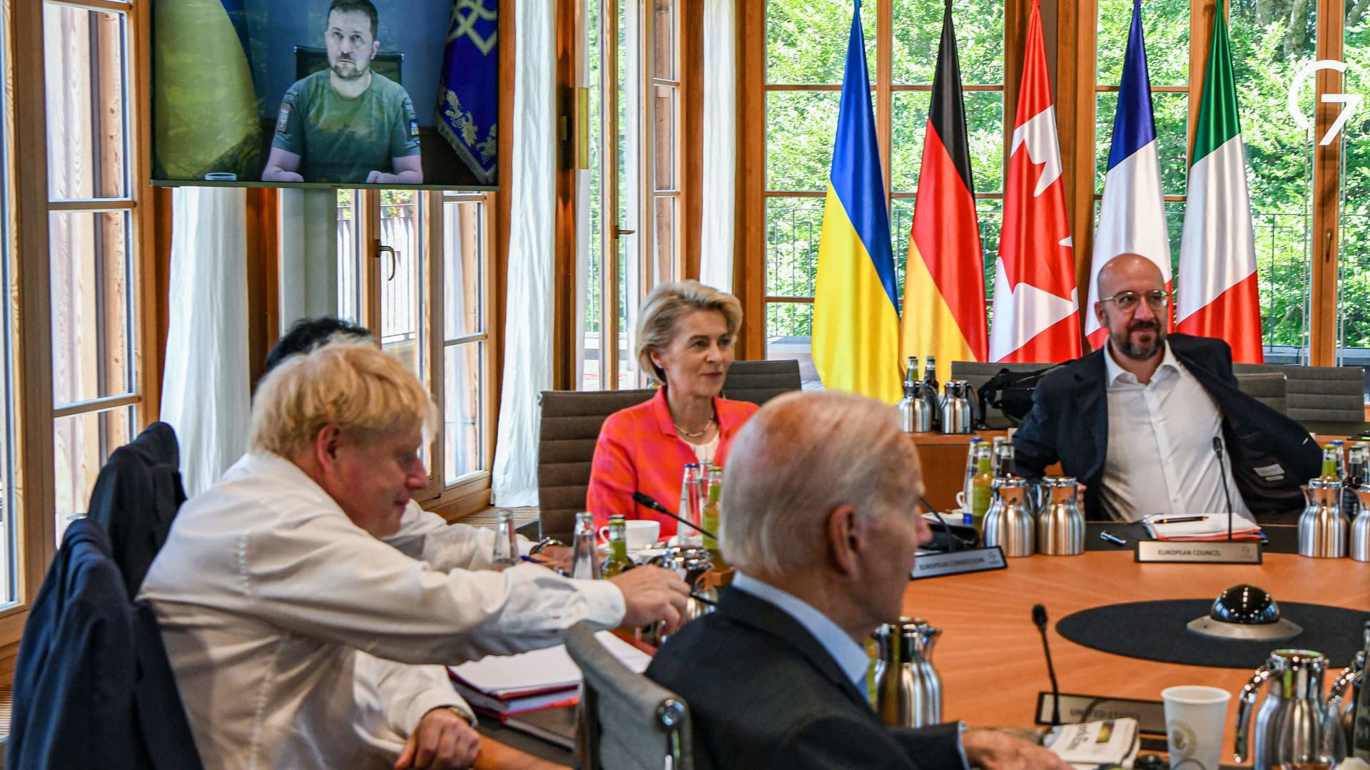 From left to right: Britain's Prime Minister Boris Johnson, European Commission President Ursula von der Leyen, US President Joe Biden and European Council President Charles Michel have taken seat at a round table on June 27, 2022 at Elmau Castle, southern Germany.