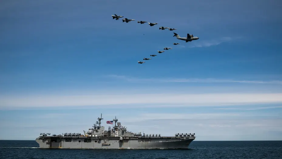 TOPSHOT - Air force from different nations fly in formation over the Wasp-class amphibious assault ship USS Kearsarge (LHD 3) on June 6, 2022, during the BALTOPS 22 Exercise in the Baltic Sea. - BALTOPS 22 is the premier maritime-focused exercise in the Baltic Region. The exercise, led by U.S. Naval Forces Europe-Africa, and executed by the NATO Naval Striking and Support Forces, provides a unique training opportunity to strengthen the combined response capability, critical to preserving the freedom of navi