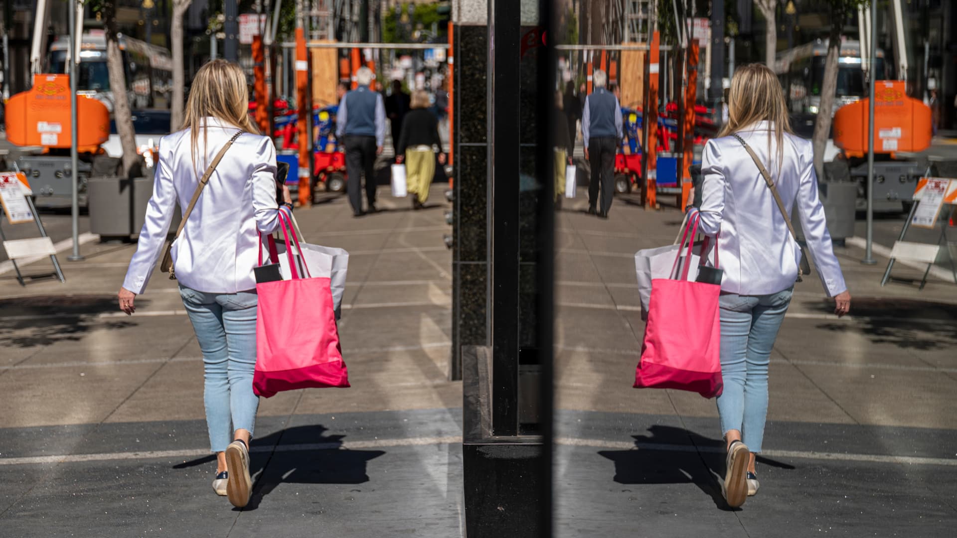 A pedestrian carries shopping bags in San Francisco, California, US, on Wednesday, June 1, 2022.