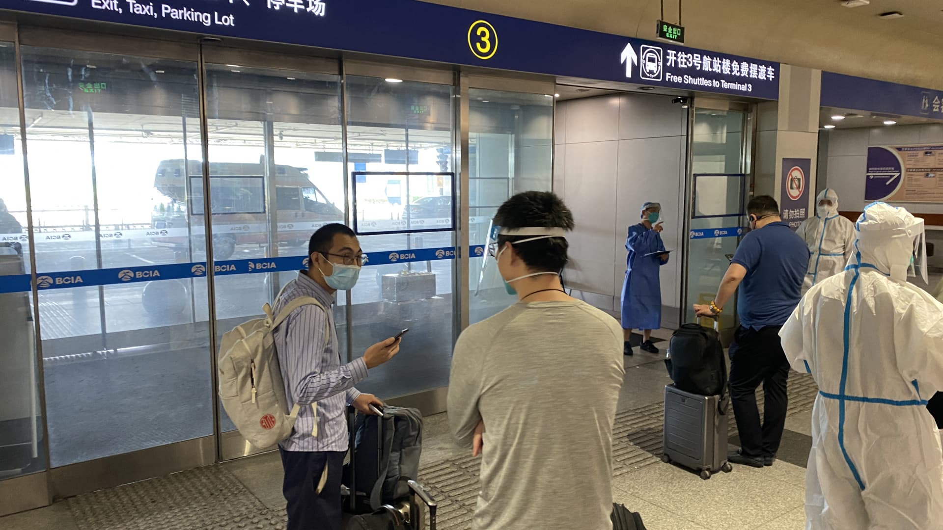 For more than two years, overseas travelers have had to quarantine upon arrival in China because of Covid restrictions. Pictured here at Beijing International Airport on June 18, 2022, are passengers waiting to be taken to quarantine-designated destinations.