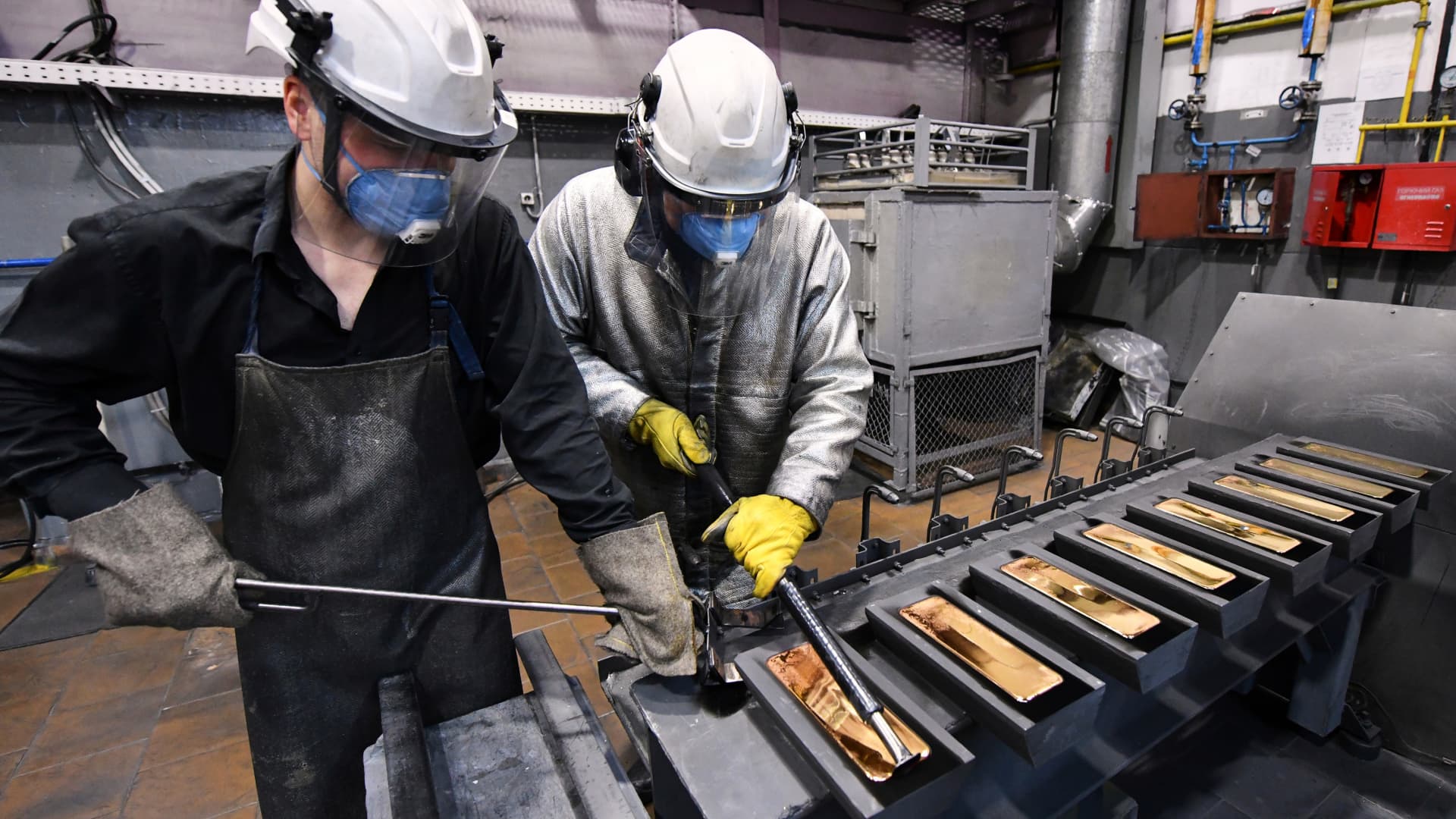 Employees process ingots of 99.99 percent pure gold at the Krastsvetmet non-ferrous metals plant in the Siberian city of Krasnoyarsk, Russia March 10, 2022.