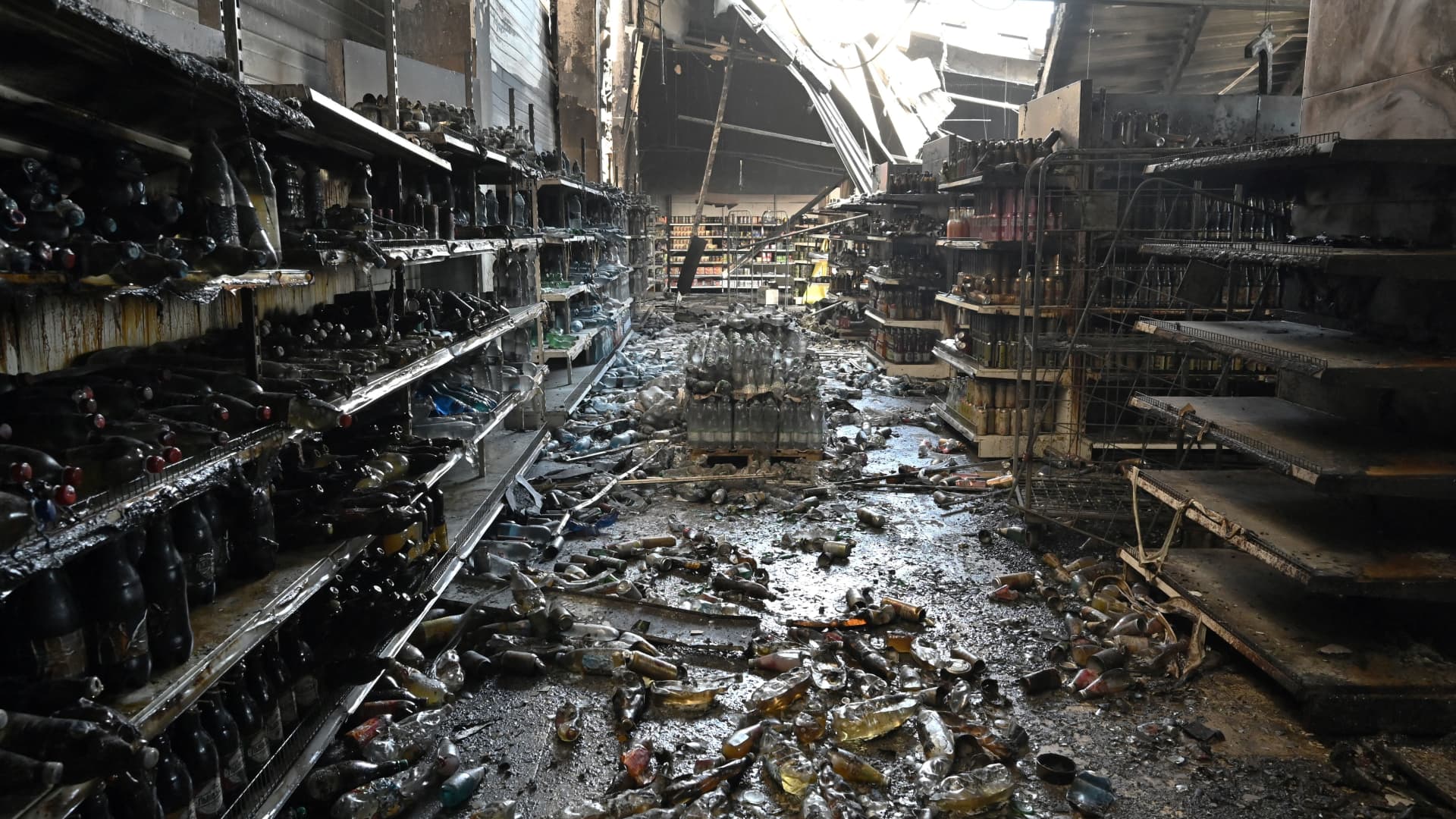 Charred goods in a grocery store of the destroyed Amstor mall in Kremenchuk, on June 28, 2022, one day after it was hit by a Russian missile strike, according to Ukrainian authorities.