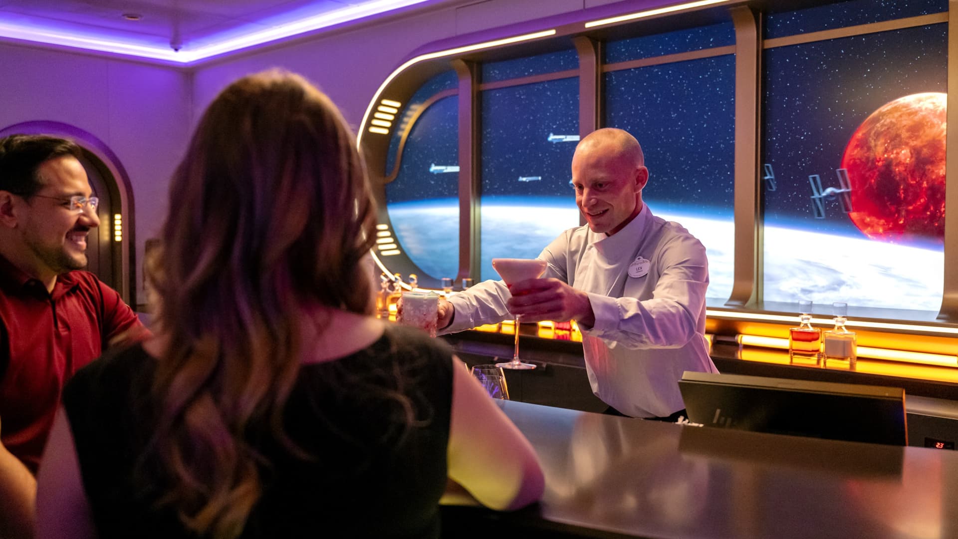 For the first time on a Disney ship, guests embark on a space-jumping tour of the Star Wars galaxy at Star Wars: Hyperspace Lounge, a high-end bar styled as a luxurious yacht-class spaceship aboard the Disney Wish.