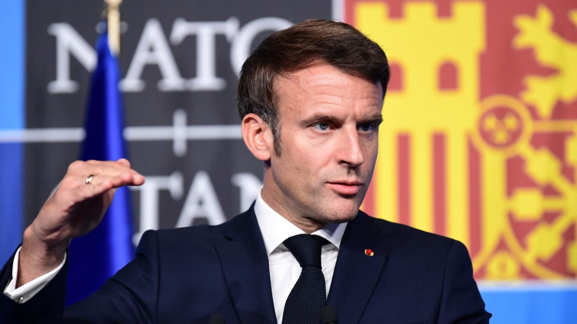 French President Emmanuel Macron gestures during a press conference on the last day of the NATO Heads of State summit in Madrid on June 30, 2022.