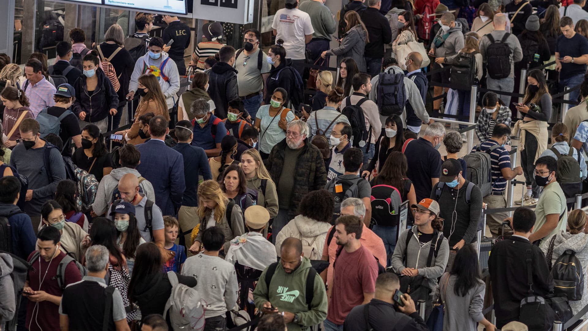 Travelers make their way through security check at San Francisco International airpot during the start of the long July 4th holiday weekend in San Francisco, California, June, 30, 2022.