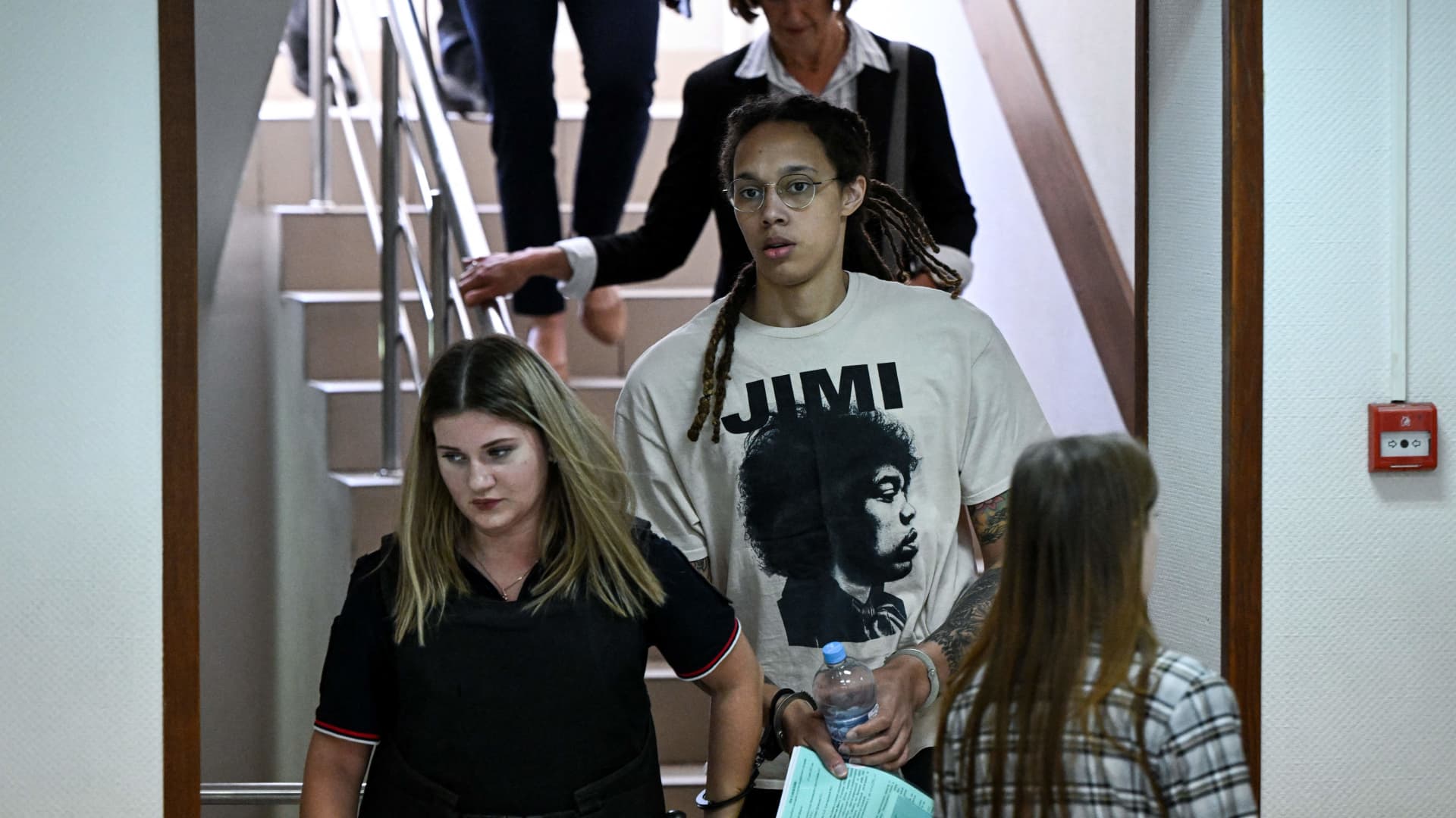 US WNBA basketball superstar Brittney Griner (C) arrives to a hearing at the Khimki Court, outside Moscow on July 1, 2022.