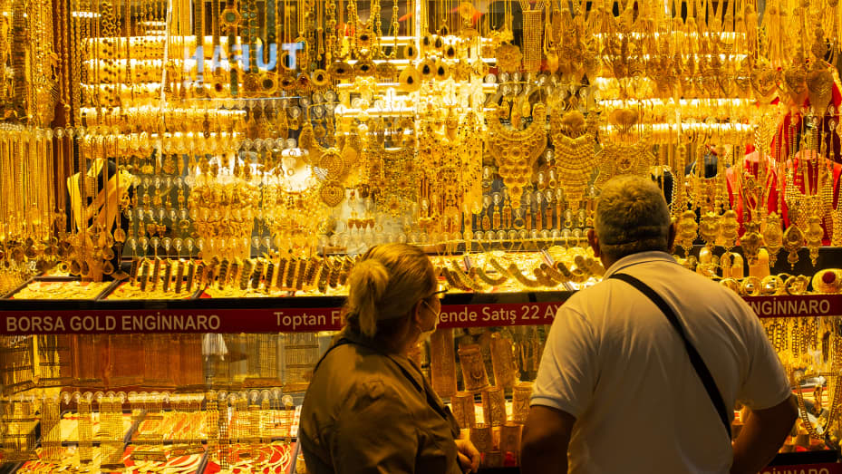 People browsing gold jewelry in Istanbul. Gold prices held steady near the key psychological level of $1,800 per ounce on Monday, supported by a pullback in the dollar and U.S. Treasury yields.