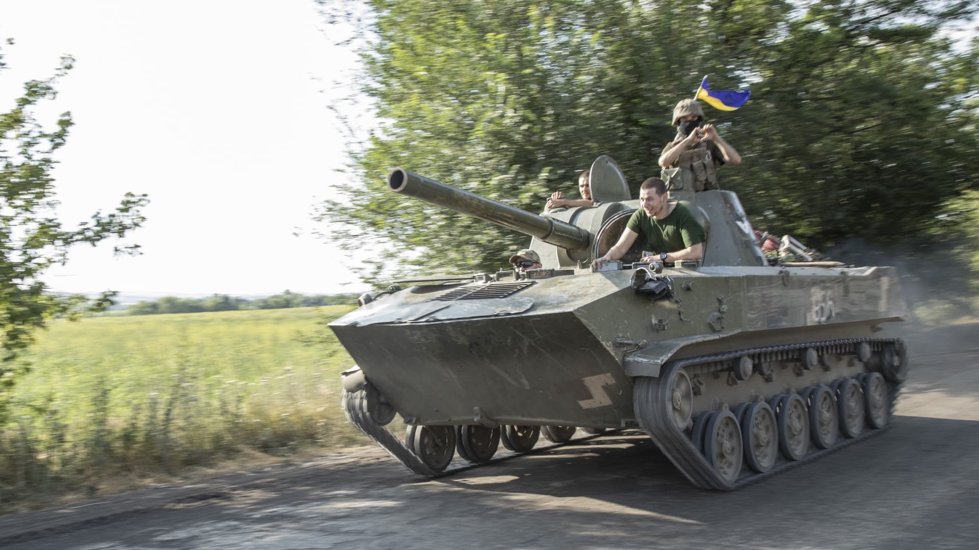 Ukrainian serviceman ride on top of a tank towards the battlefield on the Siversk frontline to the east of Sloviansk, Ukraine, July 4th, 2022.