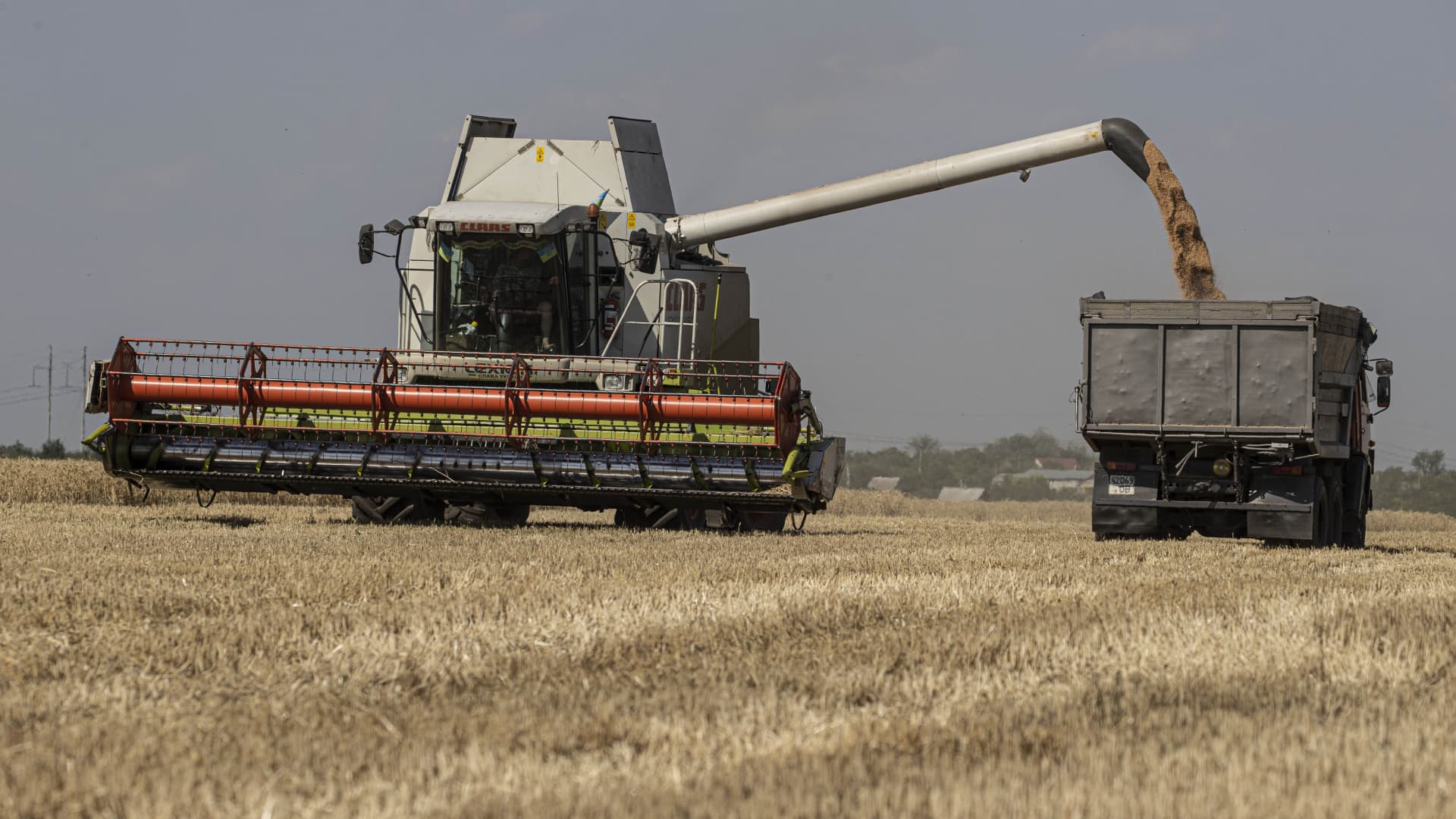 A farm implement harvests grain in the field, as Russian-Ukrainian war continues in Odesa, Ukraine on July 04, 2022.