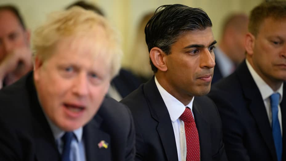 Britain's Chancellor Rishi Sunak (C) listens as Prime Minister Boris Johnson (L) addresses his Cabinet ahead of the weekly Cabinet meeting in Downing Street on June 07, 2022 in London, England.