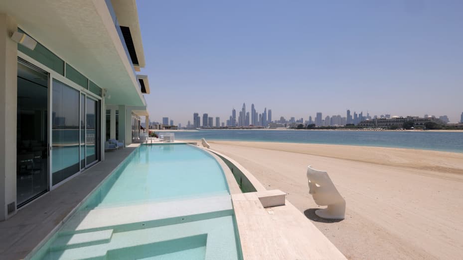 This picture shows the swimming pool of a luxury villa for sale on one of the Palm Jumeirah man-made island, on the coast of the Gulf emirate of Dubai, on May 19, 2021. Dubai's property market is powering out of a six-year malaise as "lockdown dodgers" and wealthy international investors drive a buying frenzy that is breaking records and fuelling an economic recovery. Luxury villas are the hottest segment in the market, with European buyers in particular seeking homes on Dubai's signature Palm Jumeirah man-