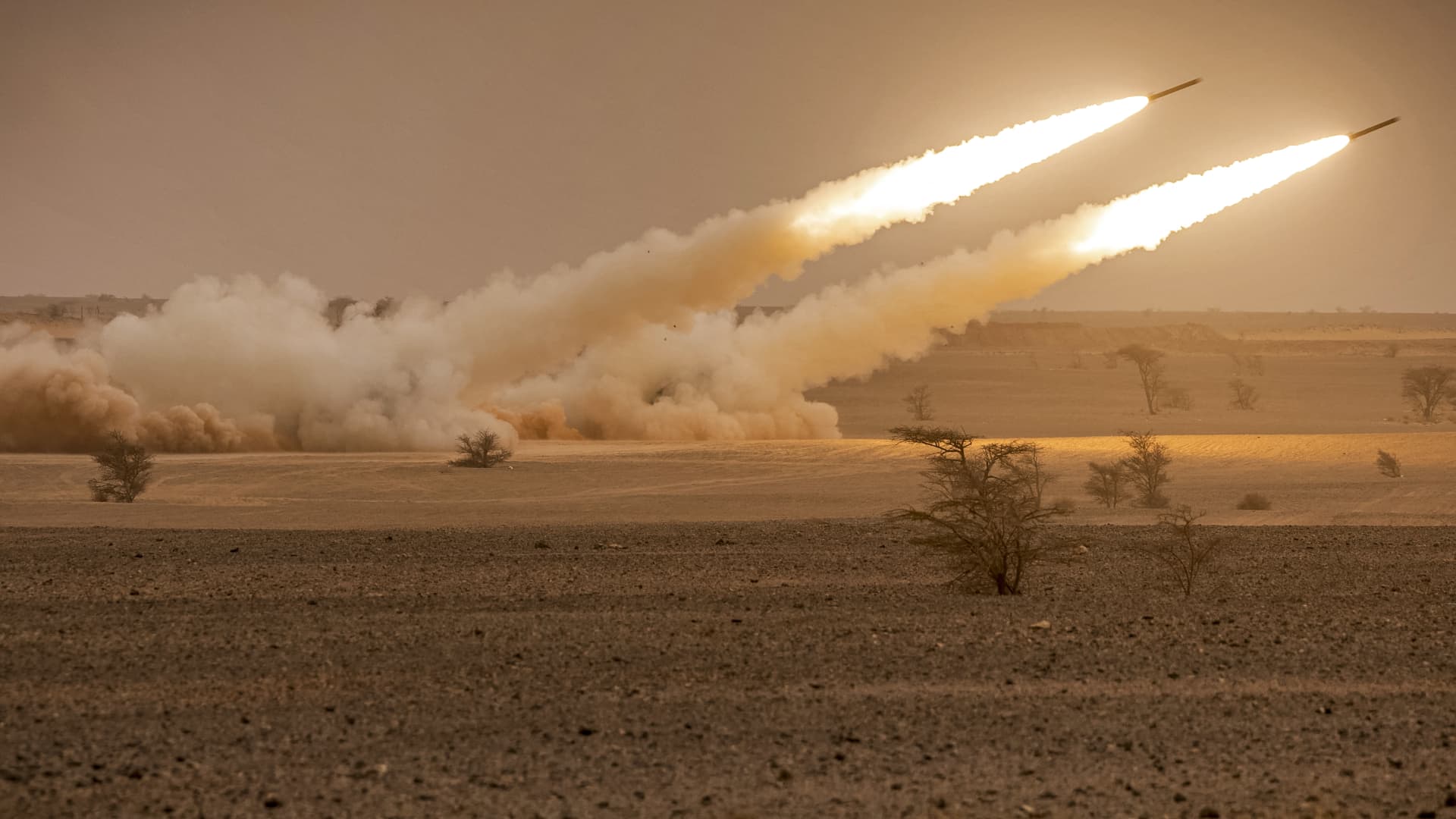 US M142 High Mobility Artillery Rocket System (HIMARS) launchers fire salvoes during the 