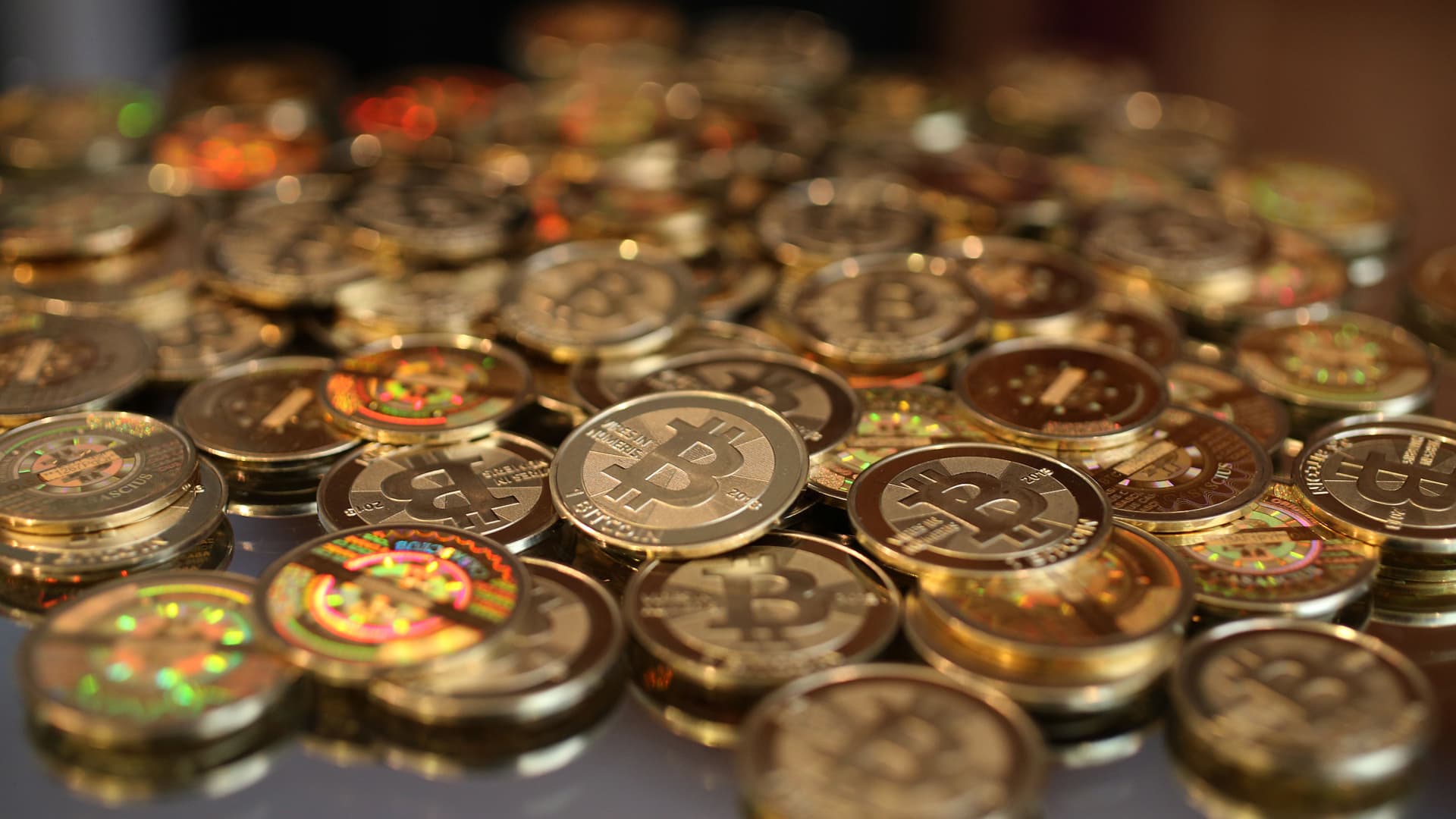 A pile of Bitcoins are shown here after Software engineer Mike Caldwell minted them in his shop in Sandy, Utah.