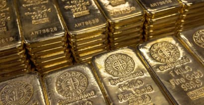 Gold stalls near multi-month peak on softer dollar