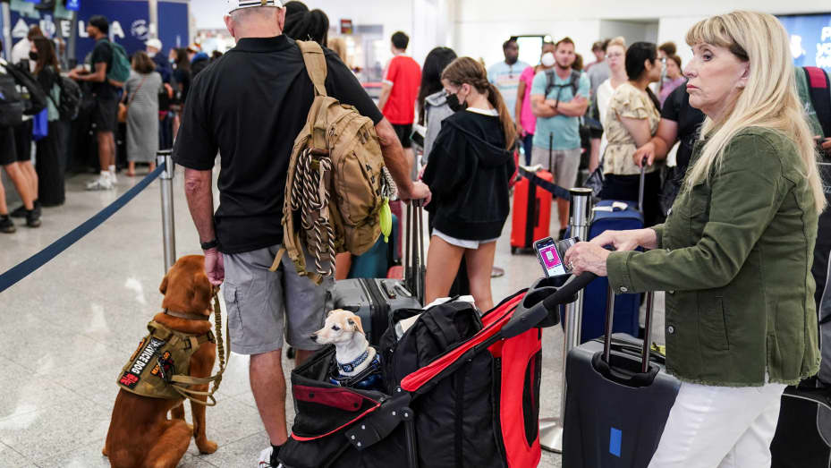 Passengers are seen at the Delta Air Lines check-in counters at Hartsfield-Jackson Atlanta International Airport ahead of the Fourth of July holiday in Atlanta, Georgia, July 1, 2022.