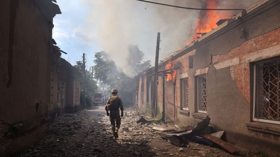 SLOVIANSK, UKRAINE - JULY 03: Fire burns at a shopping mall after it was struck by a missile on July 03, 2022 in Sloviansk, Ukraine. The attack was one of many in the city early Sunday afternoon, which targeted residential neighborhoods, destroyed homes and left at least 6 people dead and 15 injured. (Photo by Scott Olson/Getty Images)
