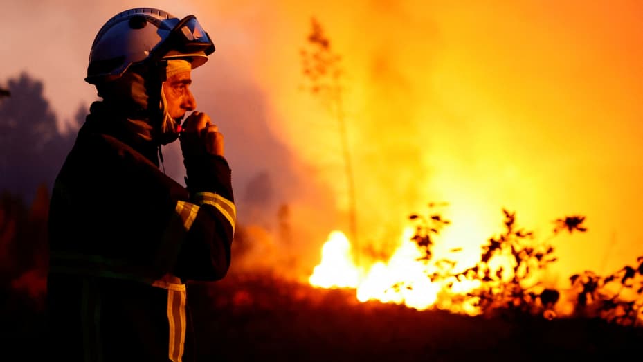 A firefighter works to contain a tactical fire in Louchats, as wildfires continue to spread in the Gironde region of southwestern France, July 17, 2022. REUTERS/Sarah Meyssonnier