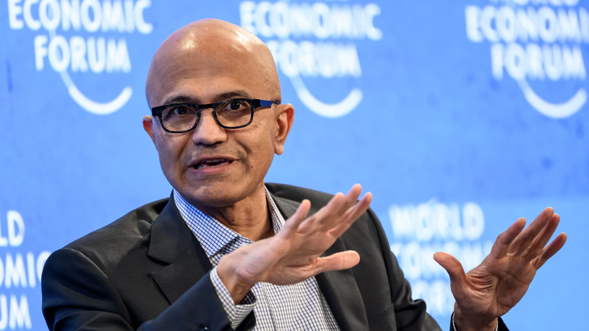 Microsoft CEO Satya Nadella gestures during a session at the World Economic Forum annual meeting in Davos on May 24, 2022.