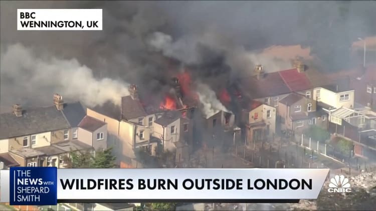 Firefighters battle wildfires outside London
