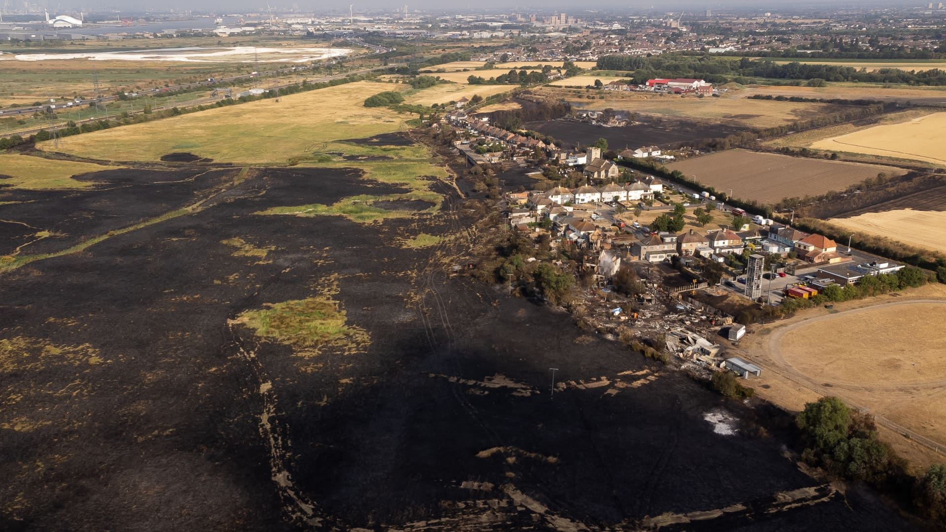 The scene after a blaze in the village of Wennington, east London after temperatures topped 40C in the UK for the first time ever, as the sweltering heat fuelled fires and widespread transport disruption. Picture date: Wednesday July 20, 2022.