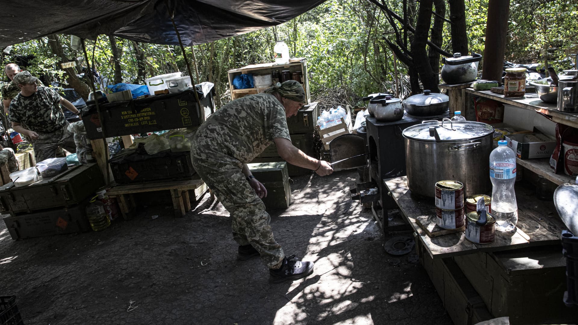 KHERSON, UKRAINE - JULY 15: Valodya, a 49-year-old man, volunteers as a cook for Ukrainian soldiers in Kherson, Kherson Oblast, Ukraine on July 15, 2022. Many Ukrainian citizens, who volunteered on the frontlines of the war, temporarily put their profession aside to support their country in various positions as official members of the army. (Photo by Metin Aktas/Anadolu Agency via Getty Images)
