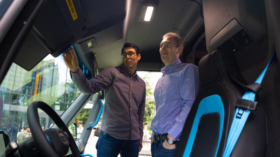 Rivian CEO RJ Scaringe and Amazon CEO Andy Jassy tour one of the company's electric delivery vans.
