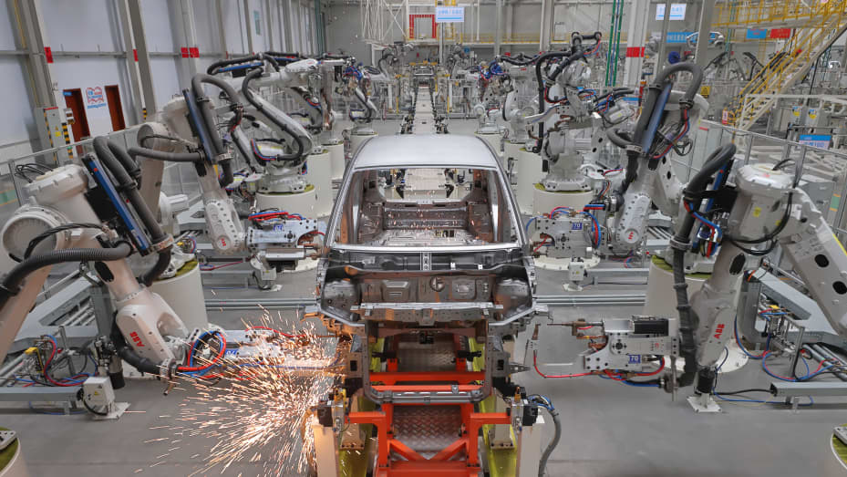 Shanghai's GDP fell by 5.7% in the first half of 2022 from a year ago. YUNCHENG, CHINA - JANUARY 14, 2022 - An intelligent welding robot arm is used to weld the frame of a new energy vehicle at a workshop in Yuncheng city, North China's Shanxi Province, Jan. 14, 2022. (Photo credit should read Yan Xin / Costfoto/Future Publishing via Getty Images)