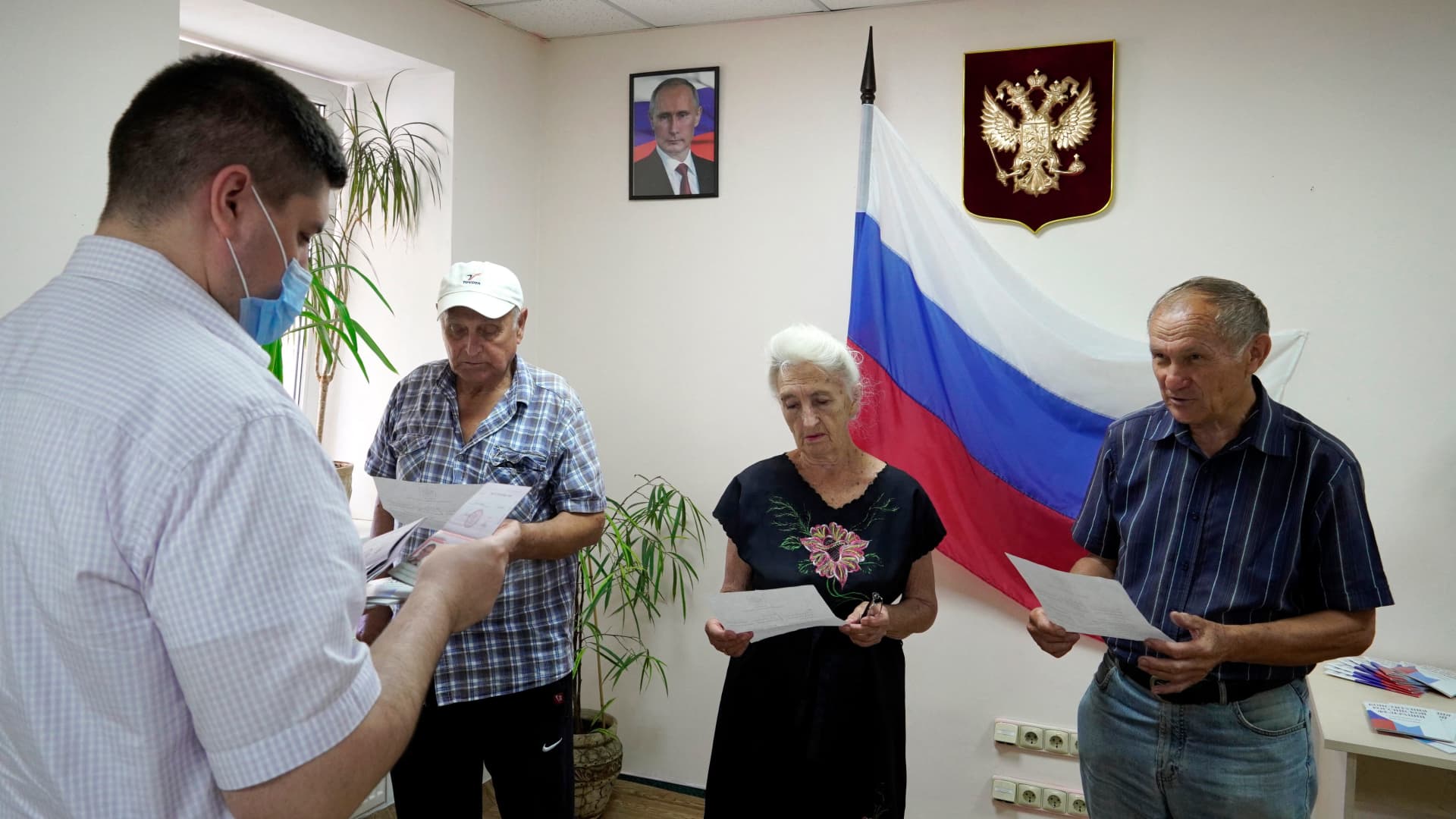 Residents receive Russian passports in Kherson on July 21, 2022, amid the ongoing Russian military action in Ukraine.