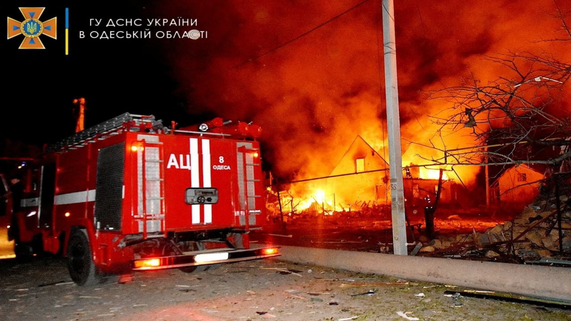 A general view shows a fire engine at a scene of a burning building after a shelling, as Russia's invasion of Ukraine continues in a location given as Odesa, Ukraine in this picture obtained from social media released on July 19, 2022.