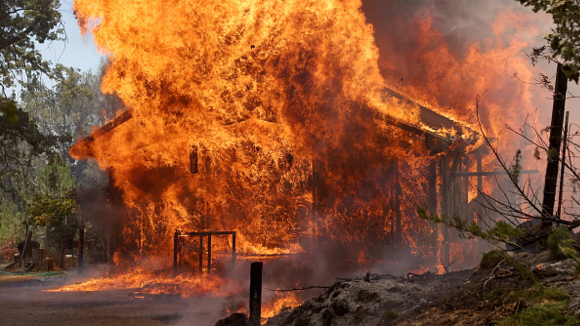 A home burn as the Oak Fire burns through the area on July 23, 2022 near Mariposa, California.