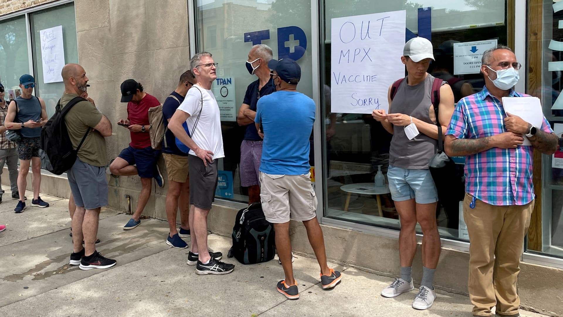 People line up outside the Test Positive Aware Network nonprofit clinic to receive the monkeypox vaccine in Chicago, Illinois, July 25, 2022