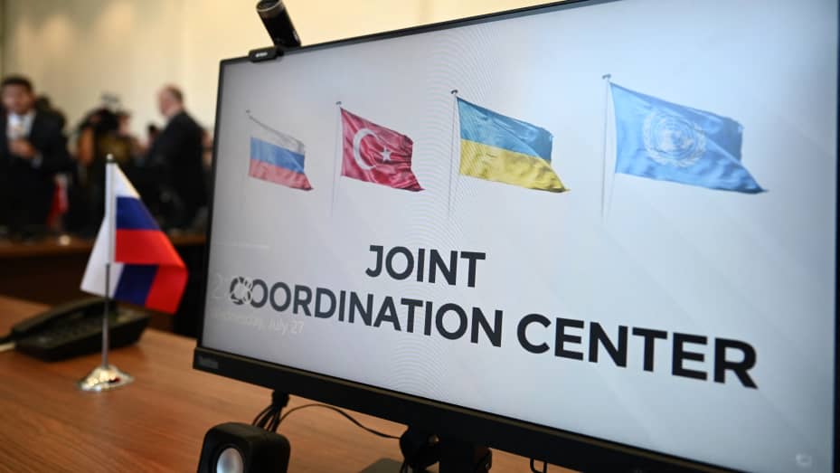 This photograph taken on July 27, 2022 shows a computer screen displaying Russian, Turkish, Ukrainian and United Nations's flags at the opening of the Joint Coordination Centre (JCC) for Ukrainian grain exports in Istanbul on July 27, 2022.
