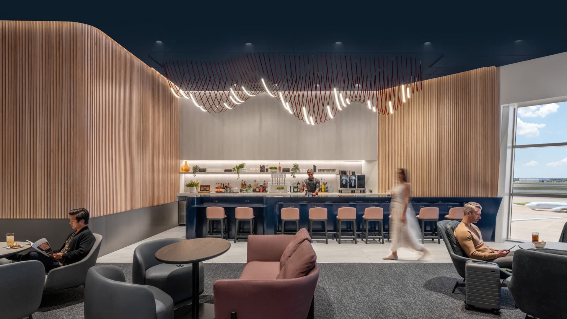 Here's how to access Capital One's new airport lounges, which feature nap pods and Peloton bikes