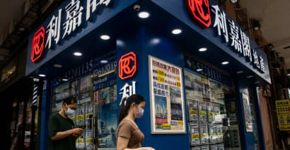Hong Kong central bank raises rates, warns of tighter interbank market
