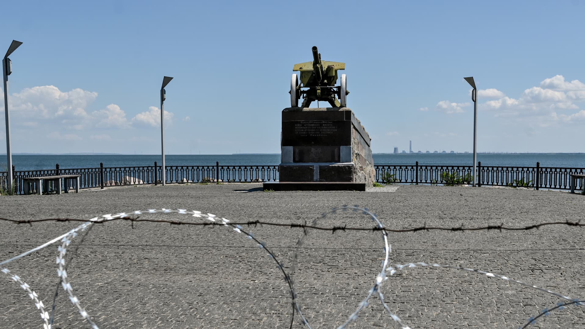 A monument pictured on the Nikopol embankment in front of the Zaporizhzhia Nuclear Power Plant used by the Russian invaders as the place to bombard Nikopol, Dnipropetrovsk Region, central Ukraine on 20 July 2022. Russian forces have seized Ukraine's second biggest power plant and Moscow will be redeploying large numbers of troops to three southern regions, said a senior advisor to Ukrainian President Zelenskyy, according to NBC News.