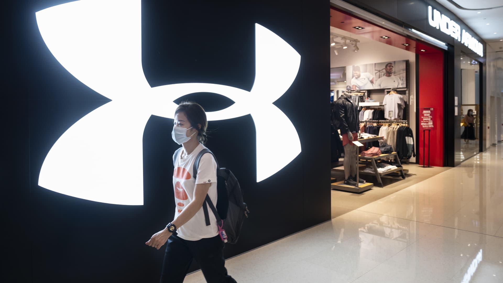 Under Armour cuts profit outlook for the full year as promotions eat into margins