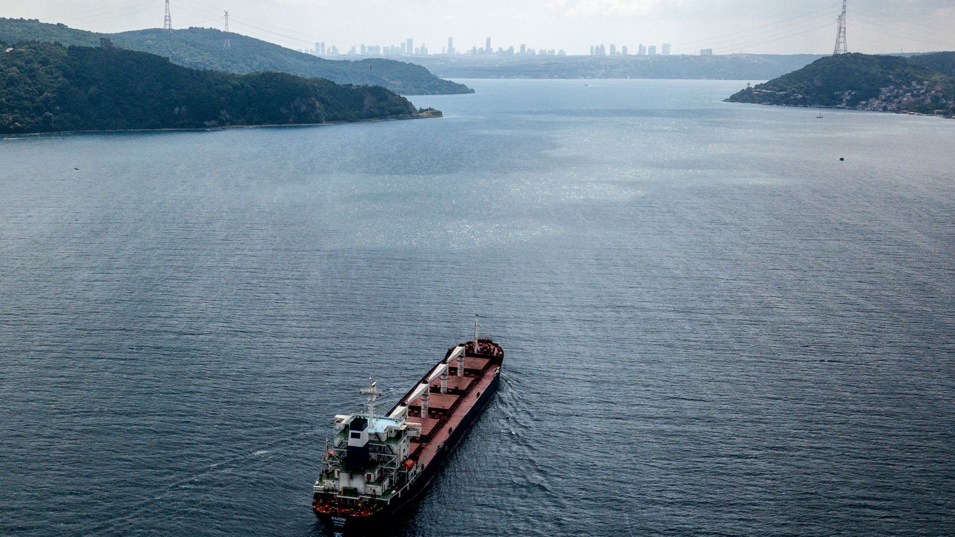 An aerial view shows the Sierra Leone-flagged cargo vessel Razoni sailing en route to Tripoli, Lebanon, along the Bosphorus Strait on August 3, 2022, after being officially inspected.