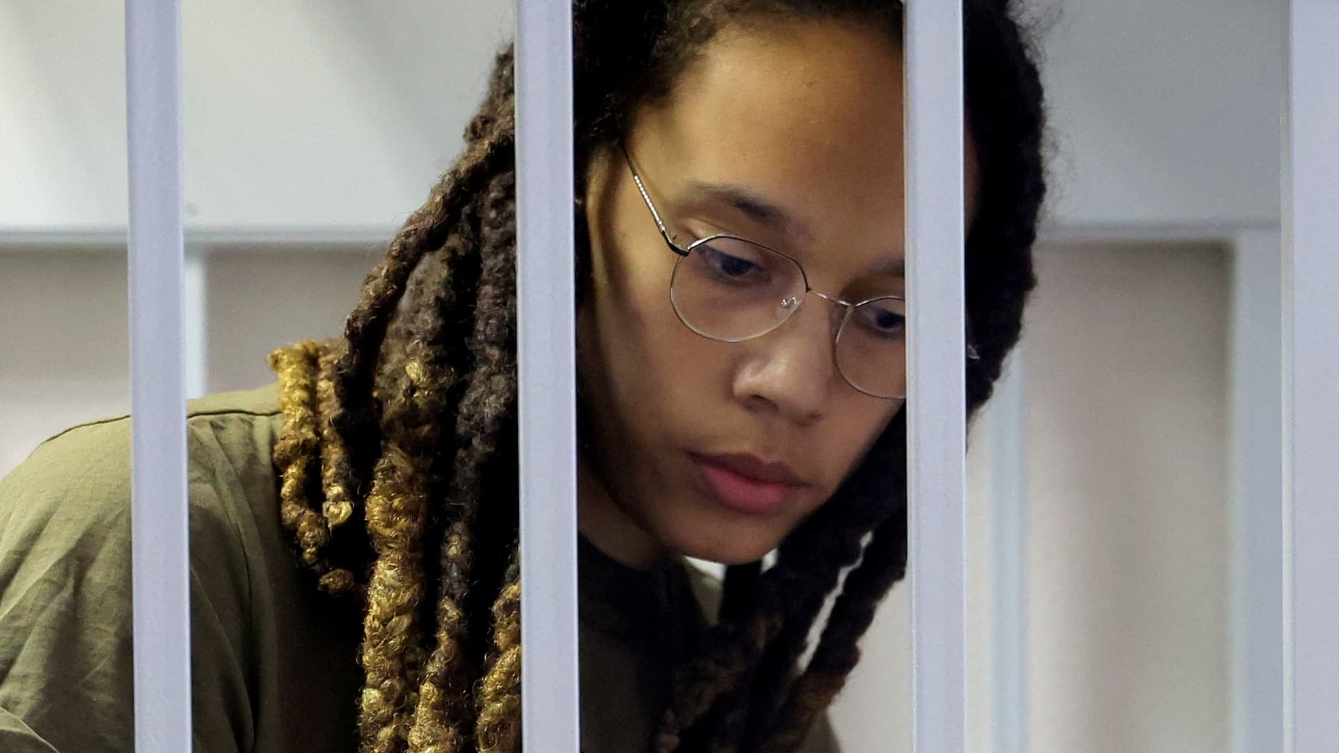 U.S. basketball player Brittney Griner, who was detained at Moscow's Sheremetyevo airport and later charged with illegal possession of cannabis, looks on inside a defendants' cage before a court hearing in Khimki outside Moscow, Russia August 2, 2022.