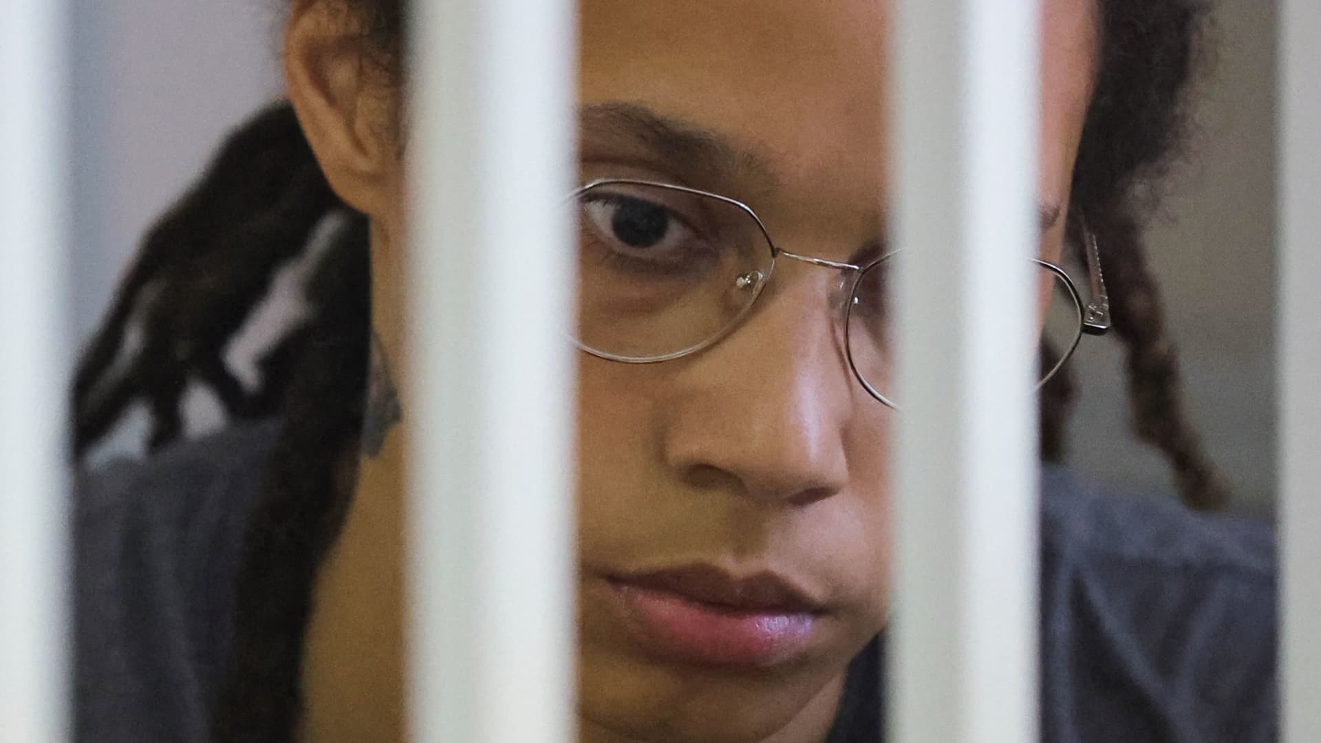 US' Women's National Basketball Association (NBA) basketball player Brittney Griner, who was detained at Moscow's Sheremetyevo airport and later charged with illegal possession of cannabis, waits for the verdict inside a defendants' cage before a court hearing in Khimki outside Moscow, on August 4, 2022.