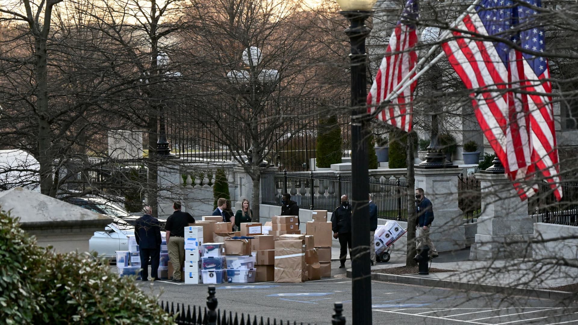 Workers move boxes out of the Eisenhower Executive Office Building on the White House grounds, before the departure of U.S. President Donald Trump, in Washington, January 14, 2021.
